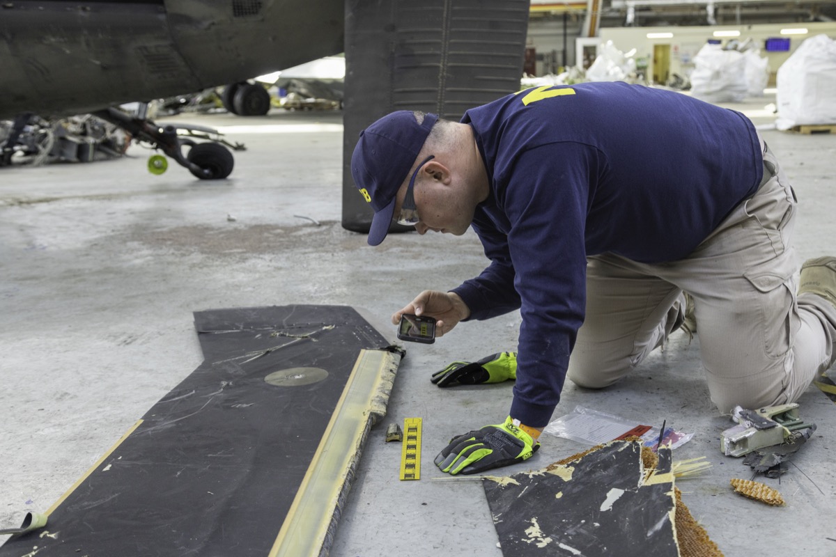 NTSB investigators document wreckage from the collision, February 9, 2025